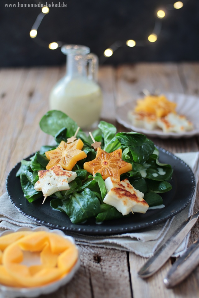 feldsalat mit orangen-buttermilchdressing und gebratenen kaki halloumi spießen