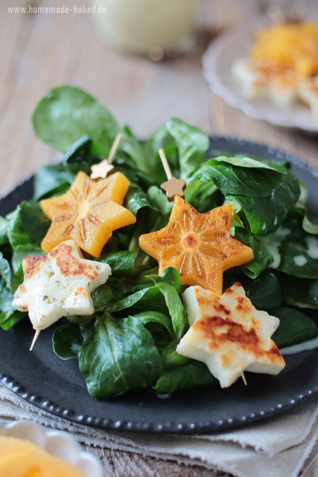 feldsalat mit orangen-buttermilchdressing und gebratenen kaki halloumi spießen